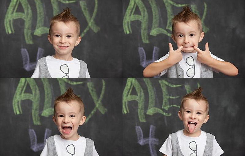 A young boy with short brown hair and a mohawk makes four different faces in front of a chalkboard with "ALEX" written in green. Captured by an Oakleaf Family photographer, he smiles, makes a silly face, shouts, and sticks out his tongue.